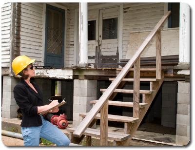 Inspector completing a residential survey Picture of an woman inspector
